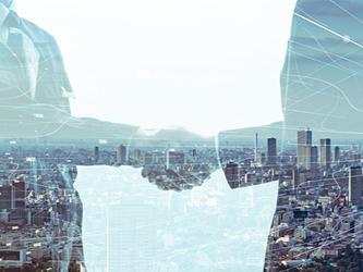 Two businessmen shake hands on a deal, with cityscape as transparent background